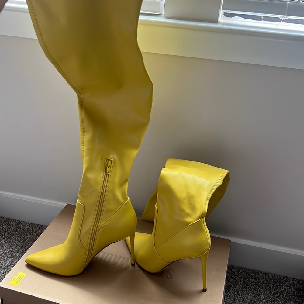 Thigh high mustard yellow boot.